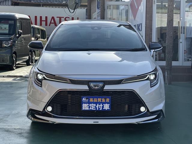 カローラツーリング ハイブリッド ダブルバイビー モデリスタエアロ&アルミホイール付 セーフティセンス LEDヘッドランプ ディスプレイオーディオ ヘッドアップディスプレイ スペアタイヤ 本革巻ステアリング シートヒーター ステアリングヒーター(40枚目)