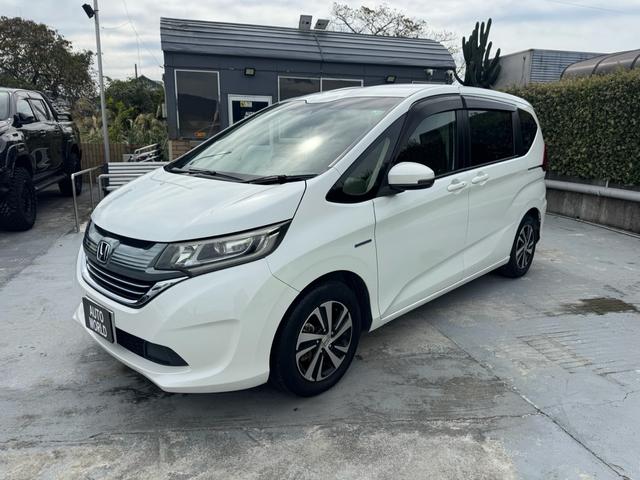 フリード＋ハイブリッド ハイブリッドＥＸ　ＬＥＤヘッドライト　９インチナビ　テレビ　バックカメラ　ＢＬＵＥＴＯＯＴＨ　ＵＳＢ　ＥＴＣ　　両側電動スライドドア　ドラレコ　アルミホイール　車検２年付き（7枚目）