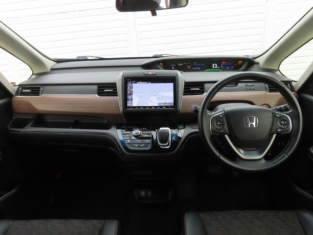 フリード+ハイブリッド ハイブリッド・クロスターホンダセンシング 9インチナビBカメラETC両側電スラフルセグ録音Bトゥース1年保証付きシートヒーター延長5年保証対応 レーダークルコン BTオーディオ 禁煙 バックカメラ 地デジフルセグ 両側電動ドア スマートキー(3枚目)