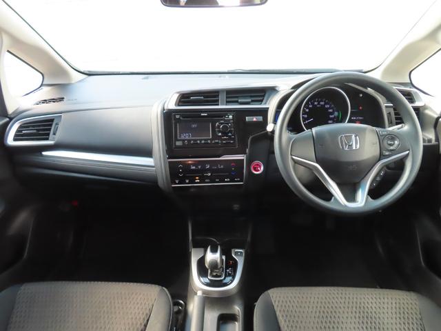 フィットハイブリッド F センシング1オーナー禁煙車検整備付延長5年保証対応 記録簿 横滑り防止装置 ACC フルオートエアコン LKAS キーフリーシステム 全席パワーウインドウ パワーステアリング ABS 電動格納ミラー(3枚目)