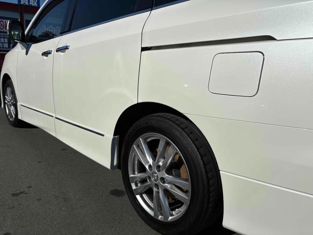 エルグランド ２５０ハイウェイスター　両側パワースライドドア　ナビ　後席モニター　ＴＶ　ＥＴＣ　Ｂカメラ　ＣＤ／ＤＶＤ　純正１８インチＡＷ　オットマン　オートライト　フォグランプ　スマートキー（14枚目）