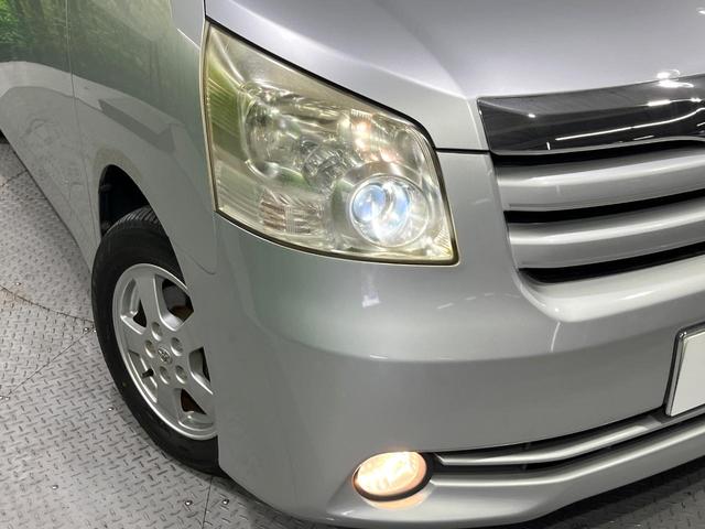 ノア Ｘ　スマートエディション　禁煙車　純正ナビ　バックカメラ　両側電動スライド　デュアルオートエアコン　ＨＩＤライト　オートライト　ＥＴＣ　スマートキー　ステアリングスイッチ　ウィンカーミラー　純正アルミホイール（12枚目）