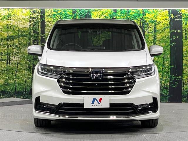 オデッセイハイブリッド ｅ：ＨＥＶアブソルート・ＥＸ　禁煙　ホンダセンシング　純正１０型ナビ　全周囲カメラ　フリップダウンモニター　両側電動スライド　パワーシート　電動リアゲート　ＡＣ１００Ｖ　コーナーセンサー　電動パーキングブレーキ　リアオートエアコン（14枚目）