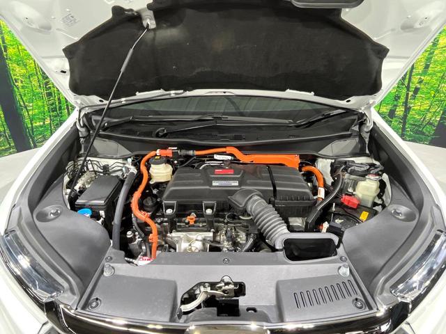 オデッセイハイブリッド ｅ：ＨＥＶアブソルート・ＥＸ　禁煙　ホンダセンシング　純正１０型ナビ　全周囲カメラ　フリップダウンモニター　両側電動スライド　パワーシート　電動リアゲート　ＡＣ１００Ｖ　コーナーセンサー　電動パーキングブレーキ　リアオートエアコン（18枚目）