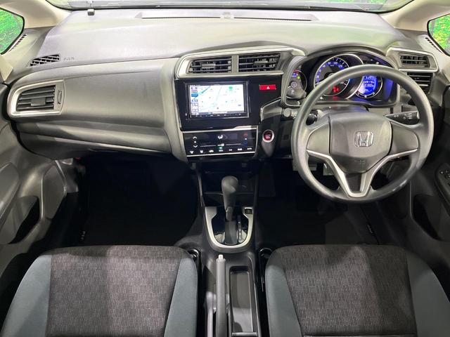 フィット 13G・Fパッケージ 禁煙車 メモリーナビ Bluetooth再生 地デジ オートエアコン ETC アイドリングストップ ライトレベライザー シートリフター 電動格納ミラー ウィンカーミラー(2枚目)