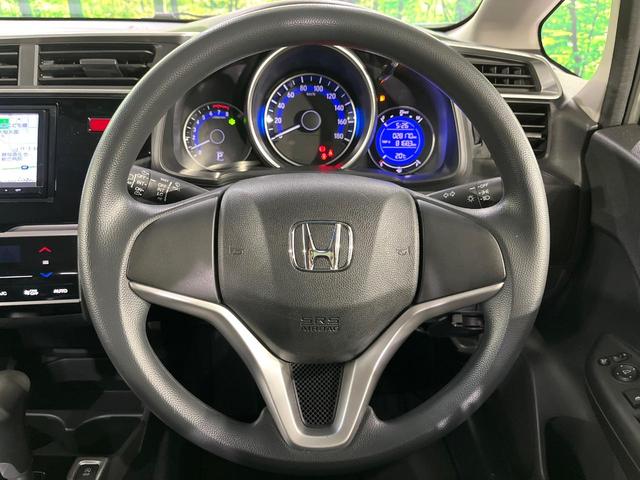 フィット 13G・Fパッケージ 禁煙車 メモリーナビ Bluetooth再生 地デジ オートエアコン ETC アイドリングストップ ライトレベライザー シートリフター 電動格納ミラー ウィンカーミラー(11枚目)