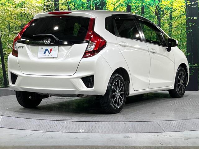 フィット 13G・Fパッケージ 禁煙車 メモリーナビ Bluetooth再生 地デジ オートエアコン ETC アイドリングストップ ライトレベライザー シートリフター 電動格納ミラー ウィンカーミラー(17枚目)