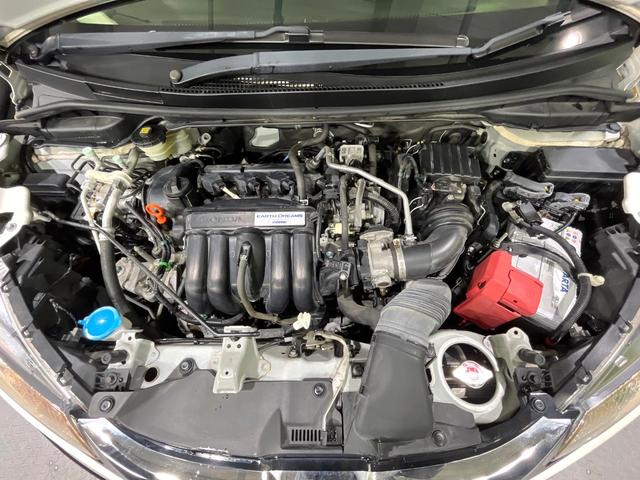 フィット 13G・Fパッケージ 禁煙車 メモリーナビ Bluetooth再生 地デジ オートエアコン ETC アイドリングストップ ライトレベライザー シートリフター 電動格納ミラー ウィンカーミラー(18枚目)