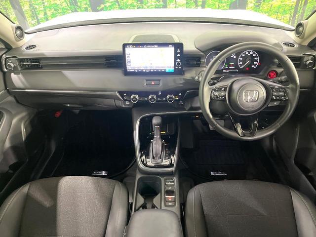 ヴェゼル ｅ：ＨＥＶ　Ｚ　禁煙車　ホンダセンシング　純正９型ナビ　全周囲カメラ　ブラインドスポット　電動リアゲート　シートヒーター　電動パーキングブレーキ　パドルシフト　ＥＴＣ　シーケンシャルターンランプ　コーナーセンサー（2枚目）