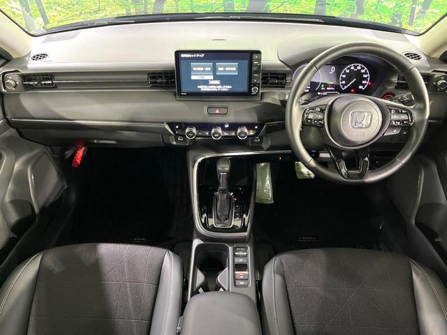 ヴェゼル ｅ：ＨＥＶ　Ｚ　禁煙車　ホンダセンシング　純正９型ナビ　バックカメラ　前席シートヒーター　ブラインドスポットモニター　電動パーキングブレーキ　パドルシフト　コーナーセンサー　シーケンシャルターンランプ　ＥＴＣ（2枚目）