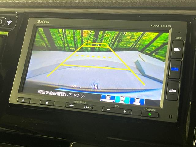 N-WGN G・Lパッケージ 禁煙車 衝突被害軽減システム 純正ナビ バックカメラ スマートキー ETC オートエアコン シートリフター ステアリングスイッチ 電動格納ドアミラー Bluetooth CD(5枚目)