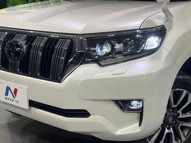 ランドクルーザープラド ＴＸ　Ｌパッケージ　禁煙車　７人乗　後期型　サンルーフ　ＢＩＧ－Ｘ９型ナビ　バックカメラ　シートエアコン　ルーフレール　前席パワーシート　ＥＴＣ　レーダークルーズコントロール　ＬＥＤライト　オートハイビーム　ベージュ革（12枚目）