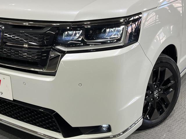 ステップワゴン e:HEVスパーダ 禁煙車 ホンダセンシング 純正11.4型ナビ フリップダウンモニター 全周囲カメラ 両側電動スライド 電動リアゲート シートヒーター パドルシフト ETC リアオートエアコン 2列目オットマン(12枚目)