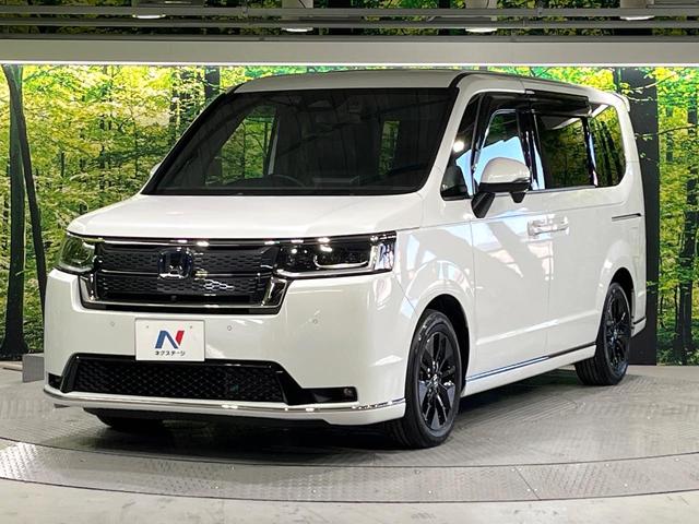 ステップワゴン e:HEVスパーダ 禁煙車 ホンダセンシング 純正11.4型ナビ フリップダウンモニター 全周囲カメラ 両側電動スライド 電動リアゲート シートヒーター パドルシフト ETC リアオートエアコン 2列目オットマン(49枚目)
