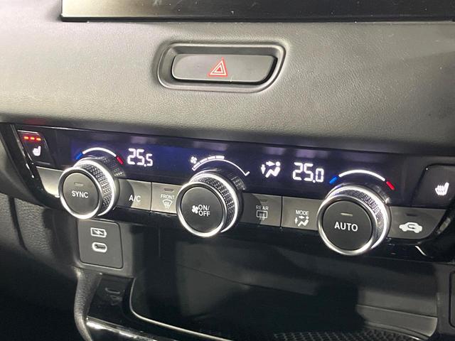 ヴェゼル ｅ：ＨＥＶ　Ｚ　禁煙車　ホンダセンシング　純正９型ナビ　バックカメラ　アダプティブクルーズ　ブラインドスポットインフォメーション　シートヒーター　ハンズフリーパワーバックドア　シーケンシャルターンランプ　ＥＴＣ（7枚目）