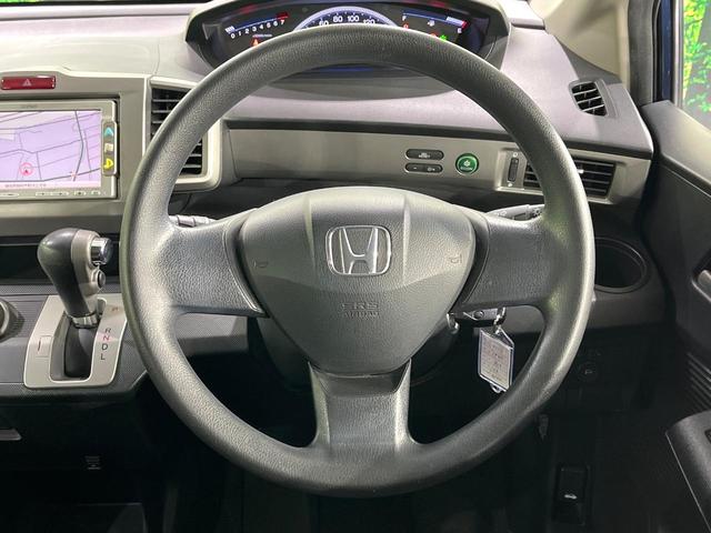 フリード Ｇ　ジャストセレクション　禁煙車　純正ナビ　バックカメラ　電動スライドドア　オートエアコン　ＥＴＣ　ＨＩＤライト　オートライト　キーレスエントリー　電動格納ミラー　ウィンカーミラー（11枚目）