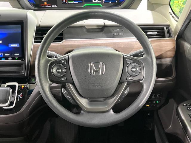 フリードハイブリッド ハイブリッド・Ｇホンダセンシング　禁煙車　ホンダセンシング　純正８型ナビ　バックカメラ　フリップダウンモニター　両側電動スライド　前席シートヒーター　レーンアシスト　オートエアコン　ＬＥＤライト　オートライト　アダプティブクルーズ（11枚目）