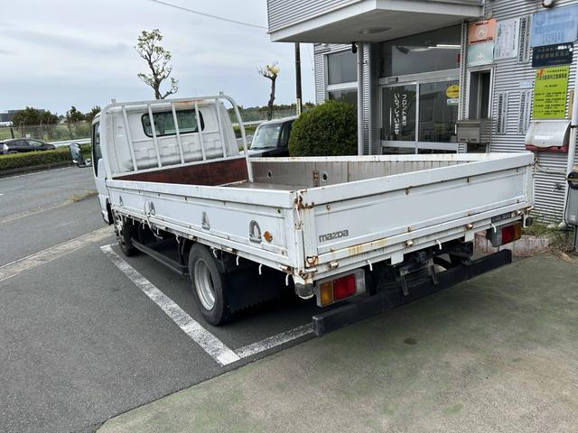 タイタントラック ワイドロングフルワイドロー　平ボディートラック２ｔ積載ワイドロング３方開きＥＴＣ車載器ロープ穴４対イージーゲート荷台鉄板張り荷台内寸長さ４３３ｃｍ幅２０２ｃｍ高さ３８ｃｍ床面地上高８７ｃｍ三方開き４８００ｃｃディーゼルターボ（14枚目）