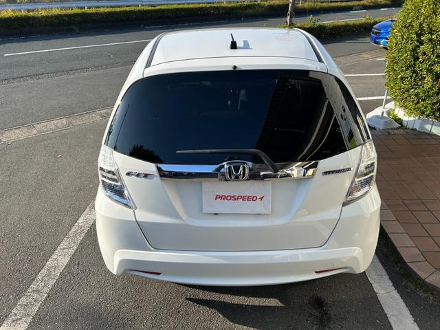 フィットハイブリッド ベースグレード 禁煙車ワンオーナーメンテナンスノート取説スペアキー付ハイブリッド車ナビTVドライブレコーダーETC車載器付ACPSPWキーレスエントリーフル装備衝突安全ボディークルーズコントロール(11枚目)