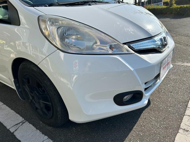 フィットハイブリッド ベースグレード 禁煙車ワンオーナーメンテナンスノート取説スペアキー付ハイブリッド車ナビTVドライブレコーダーETC車載器付ACPSPWキーレスエントリーフル装備衝突安全ボディークルーズコントロール(18枚目)