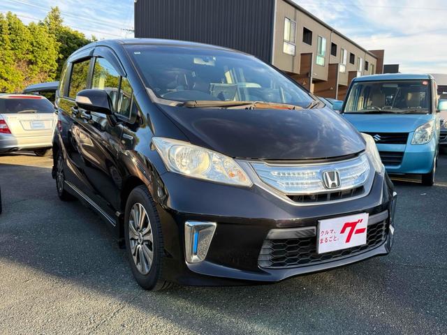 フリードハイブリッド ジャストセレクション　ドライブレコーダー　ナビ　オートクルーズコントロール　両側電動スライドドア　オートライト　ＨＩＤ　スマートキー　電動格納ミラー　３列シート　ウォークスルー　ＣＶＴ　アルミホイール　Ｂｌｕｅｔｏｏｔｈ（13枚目）