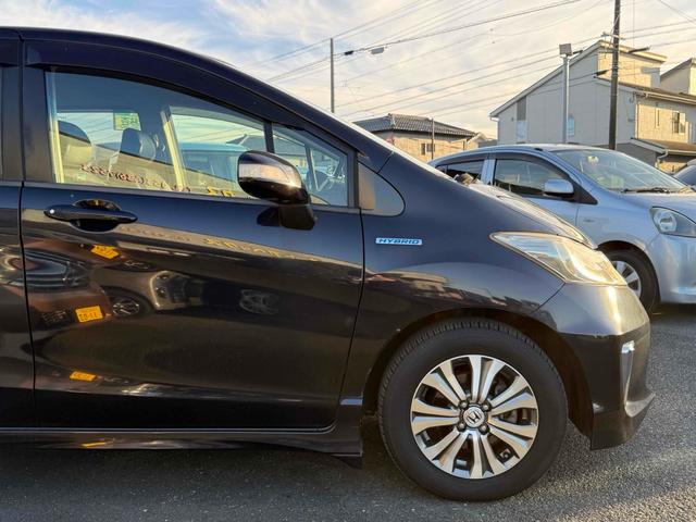 フリードハイブリッド ジャストセレクション　ドライブレコーダー　ナビ　オートクルーズコントロール　両側電動スライドドア　オートライト　ＨＩＤ　スマートキー　電動格納ミラー　３列シート　ウォークスルー　ＣＶＴ　アルミホイール　Ｂｌｕｅｔｏｏｔｈ（21枚目）