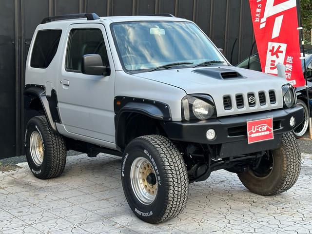 ジムニー XC 【1年間走行無制限保証】/フルカスタム車両(エアロ・マフラー・スキッドプレート・リフトアップ・ブリスターフェンダー・LEDテール・シートカバー・アルミホイール)/Bluetoothオーディオ付社外ナビ(14枚目)
