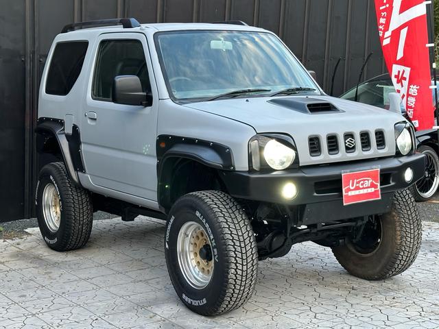ジムニー XC 【1年間走行無制限保証】/フルカスタム車両(エアロ・マフラー・スキッドプレート・リフトアップ・ブリスターフェンダー・LEDテール・シートカバー・アルミホイール)/Bluetoothオーディオ付社外ナビ(15枚目)
