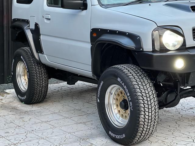 ジムニー XC 【1年間走行無制限保証】/フルカスタム車両(エアロ・マフラー・スキッドプレート・リフトアップ・ブリスターフェンダー・LEDテール・シートカバー・アルミホイール)/Bluetoothオーディオ付社外ナビ(21枚目)