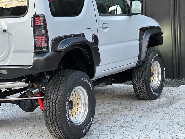 ジムニー XC 【1年間走行無制限保証】/フルカスタム車両(エアロ・マフラー・スキッドプレート・リフトアップ・ブリスターフェンダー・LEDテール・シートカバー・アルミホイール)/Bluetoothオーディオ付社外ナビ(27枚目)