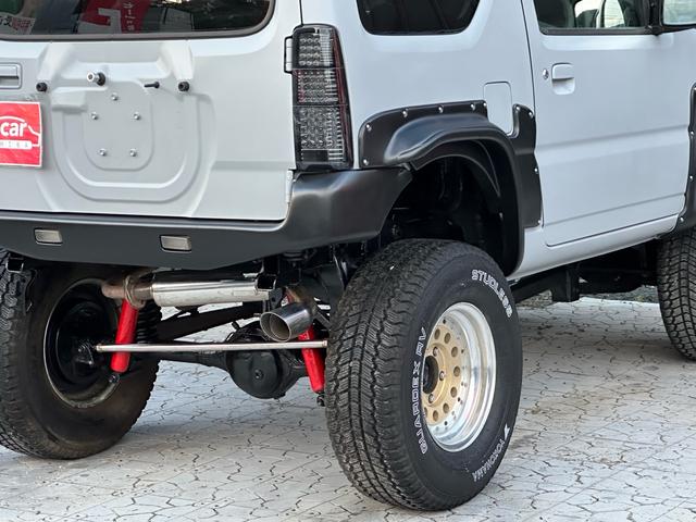 ジムニー XC 【1年間走行無制限保証】/フルカスタム車両(エアロ・マフラー・スキッドプレート・リフトアップ・ブリスターフェンダー・LEDテール・シートカバー・アルミホイール)/Bluetoothオーディオ付社外ナビ(28枚目)