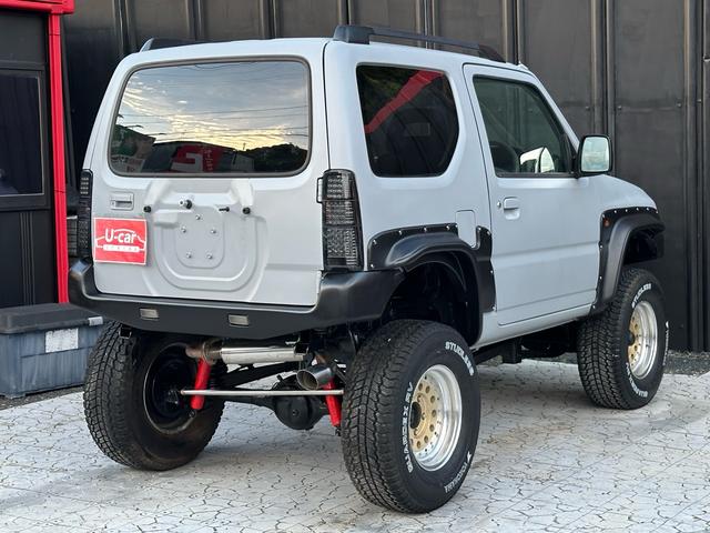 ジムニー XC 【1年間走行無制限保証】/フルカスタム車両(エアロ・マフラー・スキッドプレート・リフトアップ・ブリスターフェンダー・LEDテール・シートカバー・アルミホイール)/Bluetoothオーディオ付社外ナビ(32枚目)