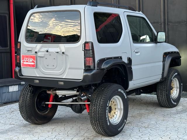 ジムニー XC 【1年間走行無制限保証】/フルカスタム車両(エアロ・マフラー・スキッドプレート・リフトアップ・ブリスターフェンダー・LEDテール・シートカバー・アルミホイール)/Bluetoothオーディオ付社外ナビ(33枚目)