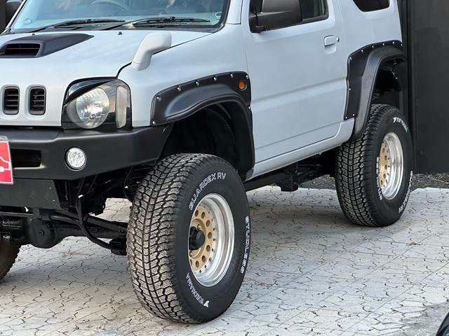 ジムニー XC 【1年間走行無制限保証】/フルカスタム車両(エアロ・マフラー・スキッドプレート・リフトアップ・ブリスターフェンダー・LEDテール・シートカバー・アルミホイール)/Bluetoothオーディオ付社外ナビ(51枚目)