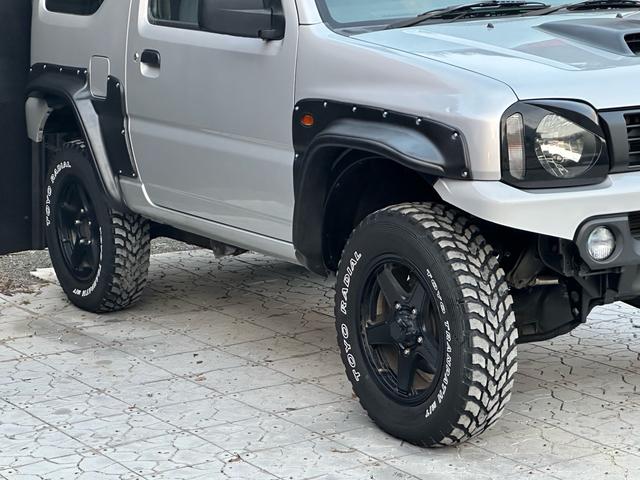 ジムニー XG 【1年間走行無制限保証】/フルカスタム車両(改バンパー・リフトアップ・ブリスターフェンダー・16インチ(BLOWS)・ヘッドライトカバー・LEDテール・マッドテレーン(TOYO TRANPATH)(18枚目)