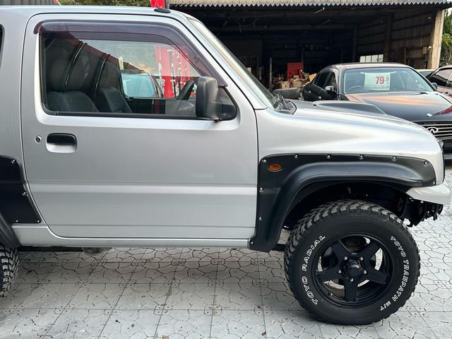 ジムニー XG 【1年間走行無制限保証】/フルカスタム車両(改バンパー・リフトアップ・ブリスターフェンダー・16インチ(BLOWS)・ヘッドライトカバー・LEDテール・マッドテレーン(TOYO TRANPATH)(21枚目)