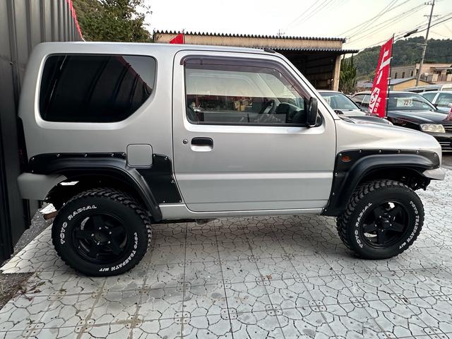 ジムニー XG 【1年間走行無制限保証】/フルカスタム車両(改バンパー・リフトアップ・ブリスターフェンダー・16インチ(BLOWS)・ヘッドライトカバー・LEDテール・マッドテレーン(TOYO TRANPATH)(23枚目)