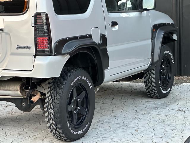 ジムニー XG 【1年間走行無制限保証】/フルカスタム車両(改バンパー・リフトアップ・ブリスターフェンダー・16インチ(BLOWS)・ヘッドライトカバー・LEDテール・マッドテレーン(TOYO TRANPATH)(25枚目)