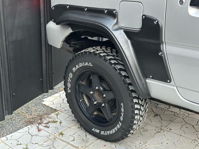 ジムニー XG 【1年間走行無制限保証】/フルカスタム車両(改バンパー・リフトアップ・ブリスターフェンダー・16インチ(BLOWS)・ヘッドライトカバー・LEDテール・マッドテレーン(TOYO TRANPATH)(56枚目)