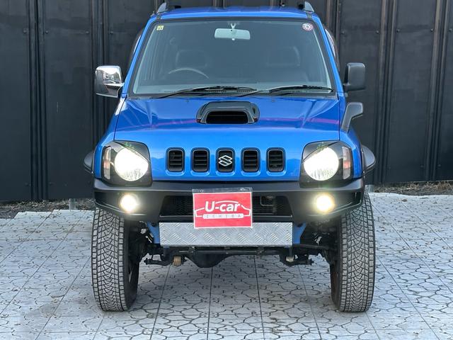 ジムニー XC 【1年間走行無制限保証】5MT/フルカスタム車両(エアロ・2本出しマフラー・スキッドプレート・リフトアップ・ブリスターフェンダー・LEDテール・シートカバー・アルミホイール・ヘッドライトカバー)(11枚目)