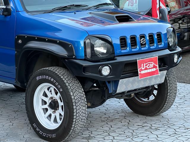 ジムニー XC 【1年間走行無制限保証】5MT/フルカスタム車両(エアロ・2本出しマフラー・スキッドプレート・リフトアップ・ブリスターフェンダー・LEDテール・シートカバー・アルミホイール・ヘッドライトカバー)(14枚目)