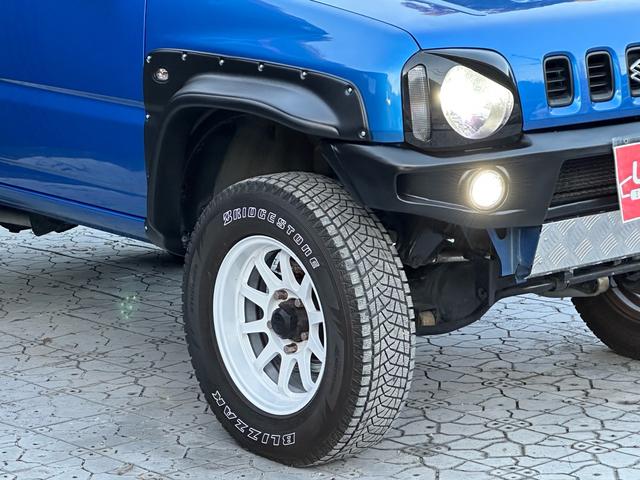 ジムニー XC 【1年間走行無制限保証】5MT/フルカスタム車両(エアロ・2本出しマフラー・スキッドプレート・リフトアップ・ブリスターフェンダー・LEDテール・シートカバー・アルミホイール・ヘッドライトカバー)(17枚目)
