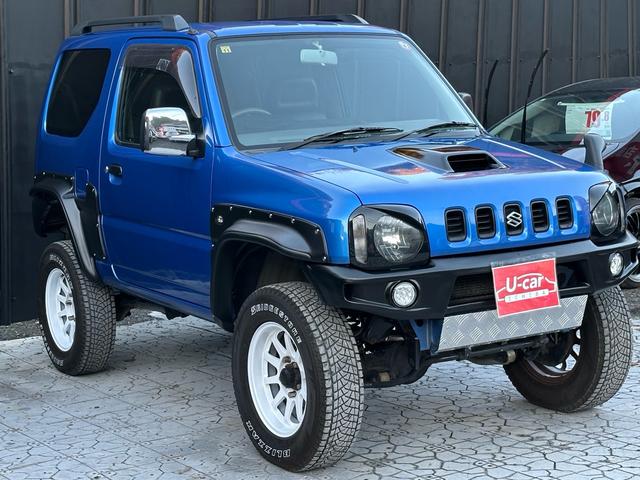 ジムニー XC 【1年間走行無制限保証】5MT/フルカスタム車両(エアロ・2本出しマフラー・スキッドプレート・リフトアップ・ブリスターフェンダー・LEDテール・シートカバー・アルミホイール・ヘッドライトカバー)(20枚目)