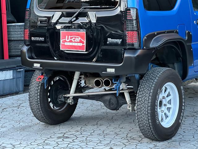 ジムニー XC 【1年間走行無制限保証】5MT/フルカスタム車両(エアロ・2本出しマフラー・スキッドプレート・リフトアップ・ブリスターフェンダー・LEDテール・シートカバー・アルミホイール・ヘッドライトカバー)(30枚目)