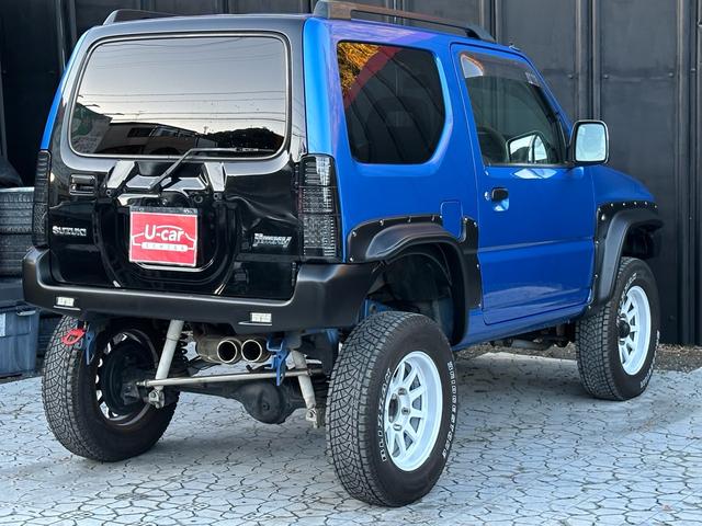 ジムニー XC 【1年間走行無制限保証】5MT/フルカスタム車両(エアロ・2本出しマフラー・スキッドプレート・リフトアップ・ブリスターフェンダー・LEDテール・シートカバー・アルミホイール・ヘッドライトカバー)(31枚目)