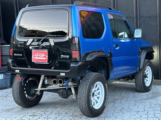 ジムニー XC 【1年間走行無制限保証】5MT/フルカスタム車両(エアロ・2本出しマフラー・スキッドプレート・リフトアップ・ブリスターフェンダー・LEDテール・シートカバー・アルミホイール・ヘッドライトカバー)(32枚目)