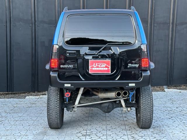ジムニー XC 【1年間走行無制限保証】5MT/フルカスタム車両(エアロ・2本出しマフラー・スキッドプレート・リフトアップ・ブリスターフェンダー・LEDテール・シートカバー・アルミホイール・ヘッドライトカバー)(34枚目)