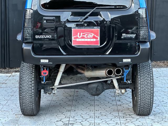 ジムニー XC 【1年間走行無制限保証】5MT/フルカスタム車両(エアロ・2本出しマフラー・スキッドプレート・リフトアップ・ブリスターフェンダー・LEDテール・シートカバー・アルミホイール・ヘッドライトカバー)(35枚目)