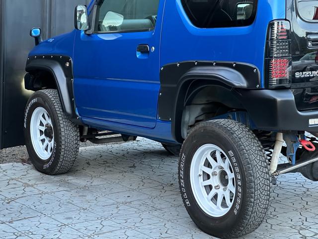 ジムニー XC 【1年間走行無制限保証】5MT/フルカスタム車両(エアロ・2本出しマフラー・スキッドプレート・リフトアップ・ブリスターフェンダー・LEDテール・シートカバー・アルミホイール・ヘッドライトカバー)(45枚目)