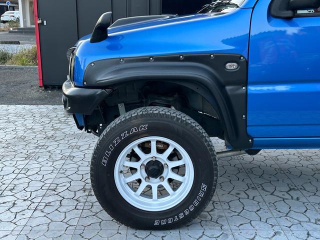 ジムニー XC 【1年間走行無制限保証】5MT/フルカスタム車両(エアロ・2本出しマフラー・スキッドプレート・リフトアップ・ブリスターフェンダー・LEDテール・シートカバー・アルミホイール・ヘッドライトカバー)(49枚目)
